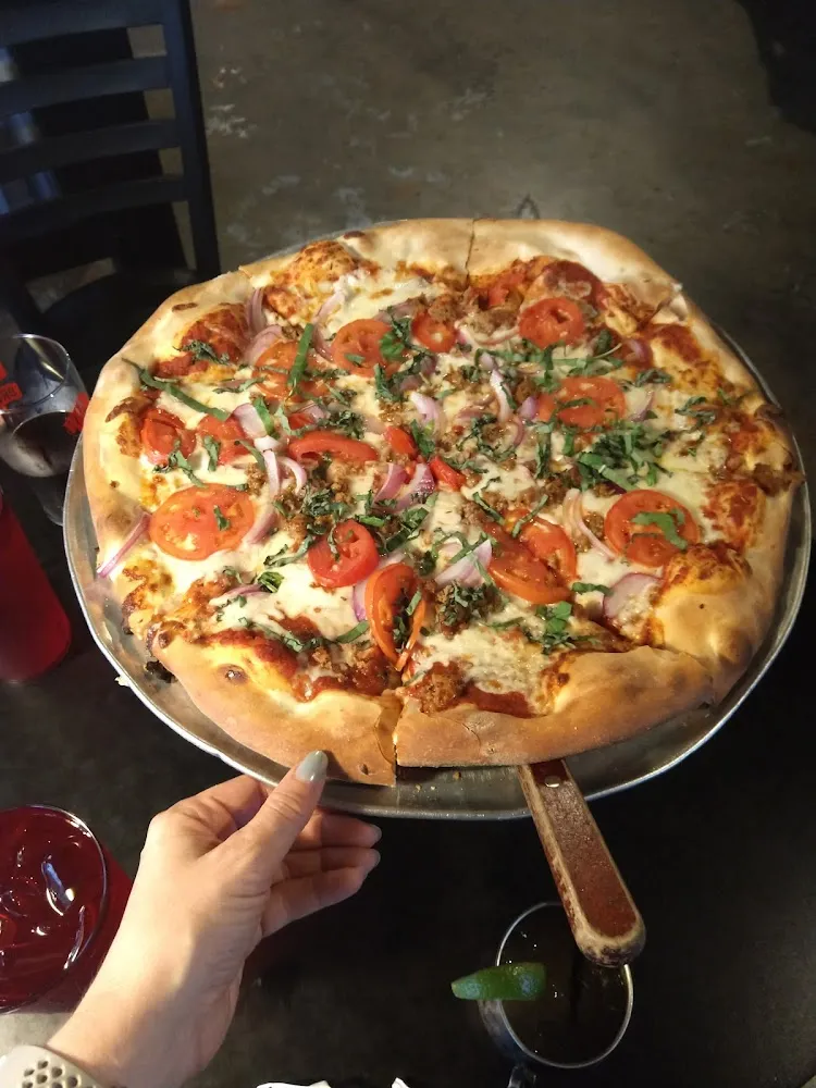 Pizza with Onion Italian Sausage and Fresh Basil
